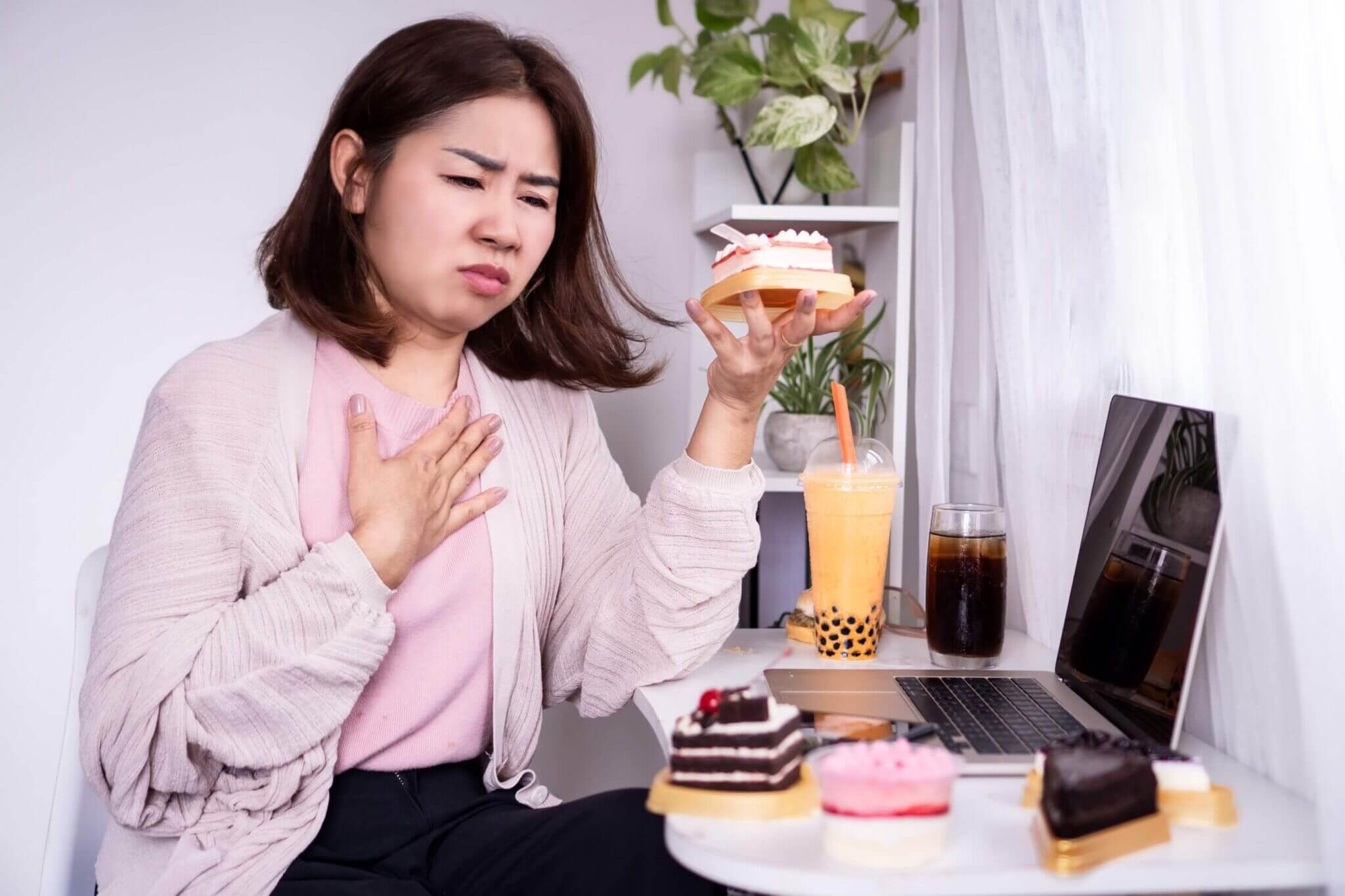 Woman suffering from acid reflux issues